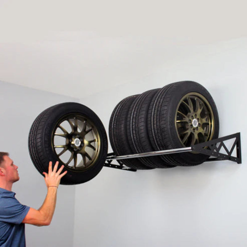 Man loading tires on Saferacks Tire rack